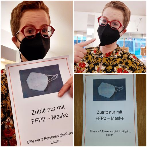 Person mit FFP2-Maske vor Zugangsschild