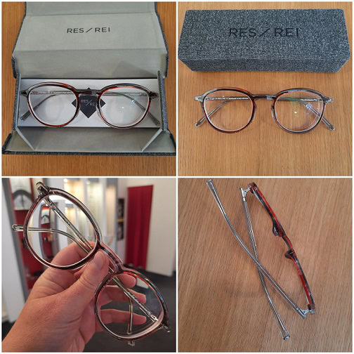 Runde Brille in Etui und auf Tisch